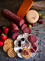 Close up of lehrs summer sausage on patriotic plate