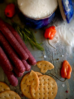 Subtle blend of sweetness and touch of mild spice elevates our signature Old World sausage recipe for those seeking a Tasty compromise. It’s not too sweet, it’s not too spicy, it’s just right.  Hunting, Hiking, Biking, Camping, add to your favorite Sausage recipe. Perfect sausage snack stick for any occasion.   Approximately 3/4 Lb. of tasty goodness delivered right to your door!   9 Smokie Snack Sticks per package